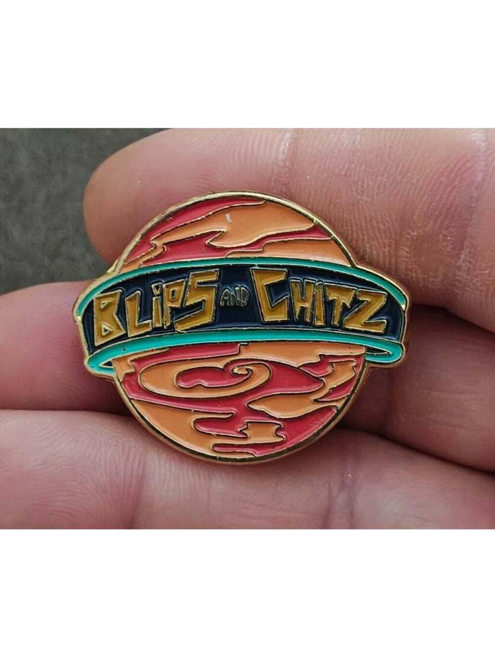 Funko Rick & Morty Blips & Chitz Exclusive Gold Tone Orange Enamel Pin.